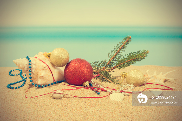 Christmas tree decorations on the beach in tropical. Concept of new year holiday in hot countries