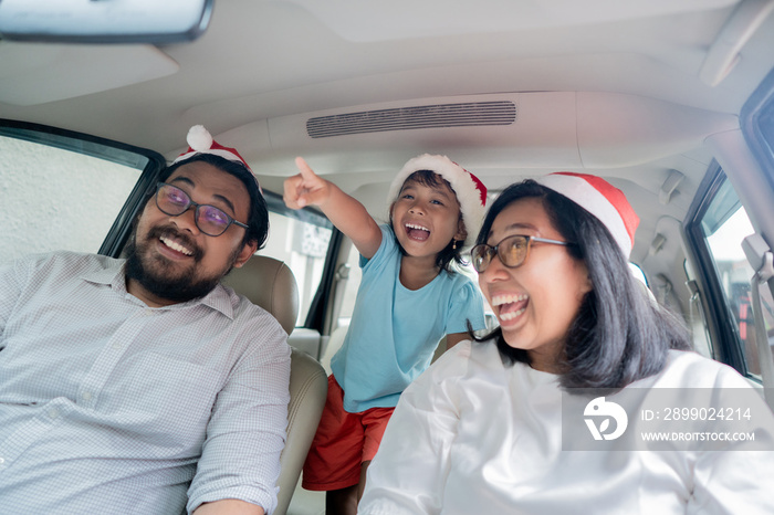 family on vacation driving a car. enjoy family christmas holiday trip together