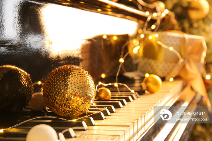 Piano keyboard with Christmas decor, closeup