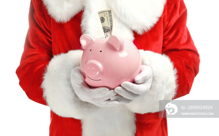 Santa Claus holding piggy bank with  banknote on white background