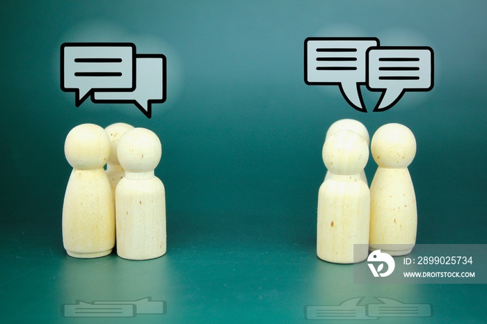 two groups of wooden figure conversation. the concept of cyberspace conversation or gossip. message,