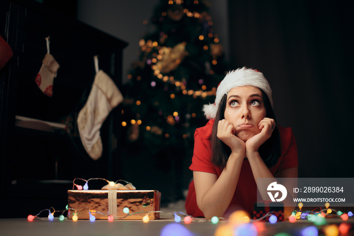 Sad Stressed Woman Thinking under the Christmas Tree