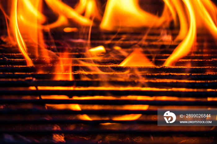 Empty hot charcoal barbecue grill with bright flame