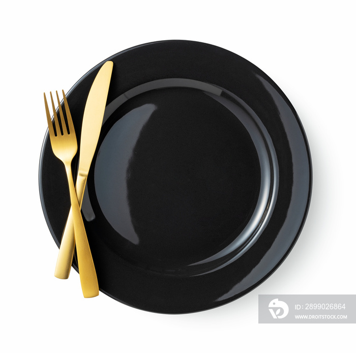 Gold knives and forks on a white background, empty black plate. Beautiful gold cutlery.