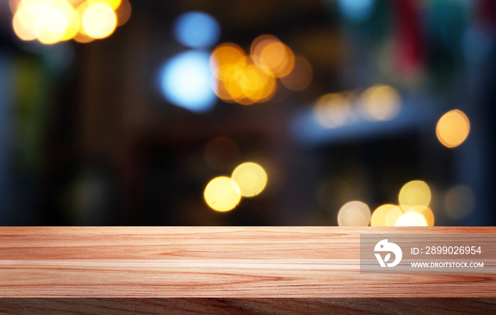 Empty wood table,bar on blurred  bokeh restaurant or cafe background./Can used for display or montag