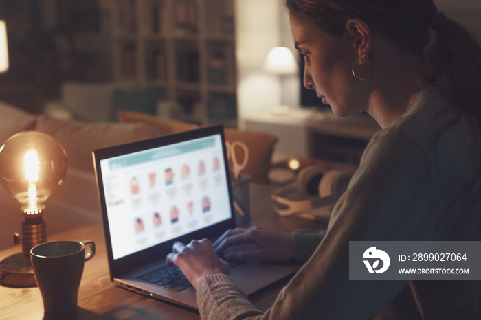 Woman browsing the internet on her laptop