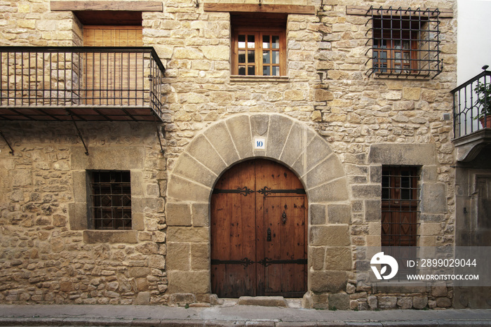 traditional stone facade of a 2-storey house 16th century architecture, Rubielos de Mora