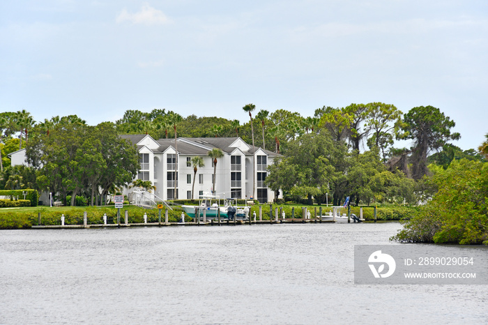 Apartment buildings and boat docks along the St Lucie River estuary in Port St Lucie, Florida