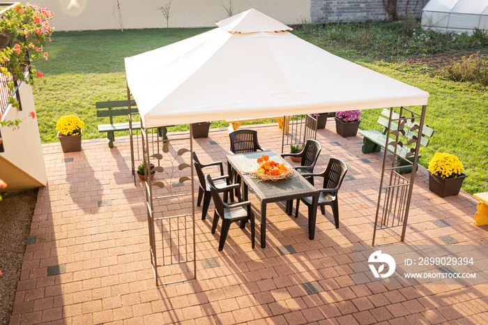 Patio with garden furniture and parasol