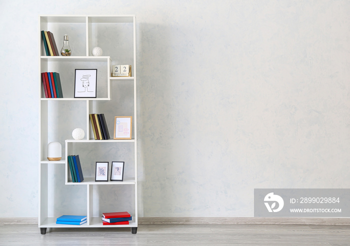 Modern interior with shelf unit and books in room