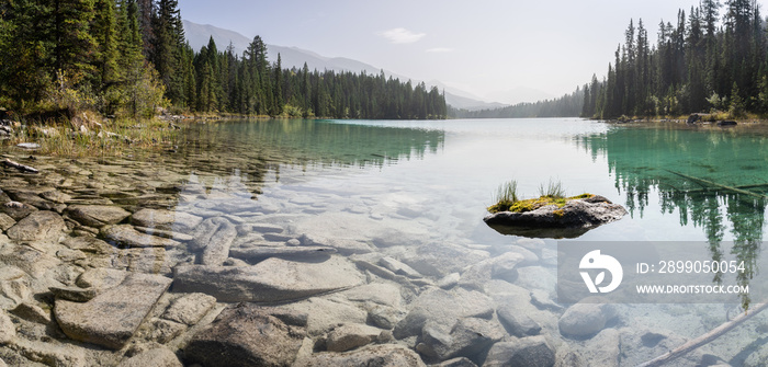 Panoramic view on pristine alpine lake with greenish colour, Jasper National Park, Canada