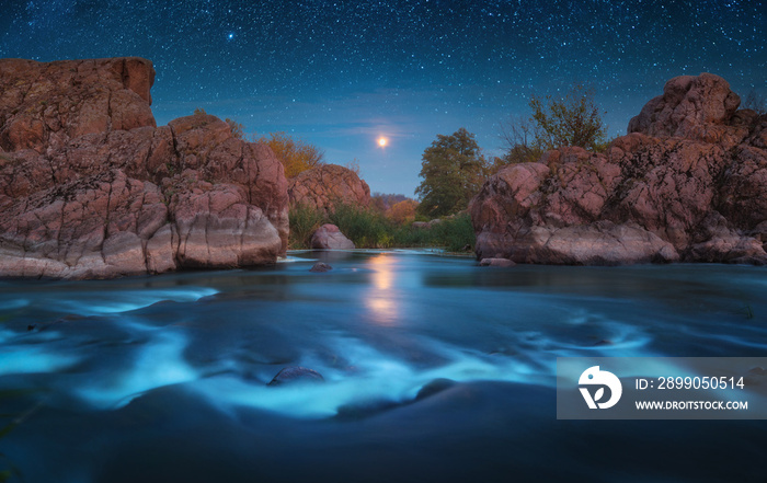 Magestic moonrise above the rocky river