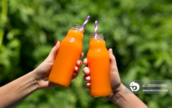 Summer tasty and refreshing orange juice with straw