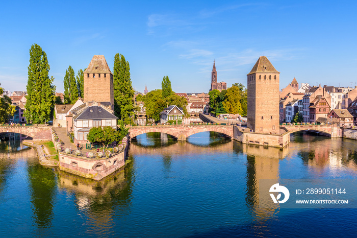 The Ponts Couverts, a medieval set of bridges and towers on the river Ill at the entrance of the Petite France historic quarter in Strasbourg, France, and Notre-Dame cathedral in the distance.