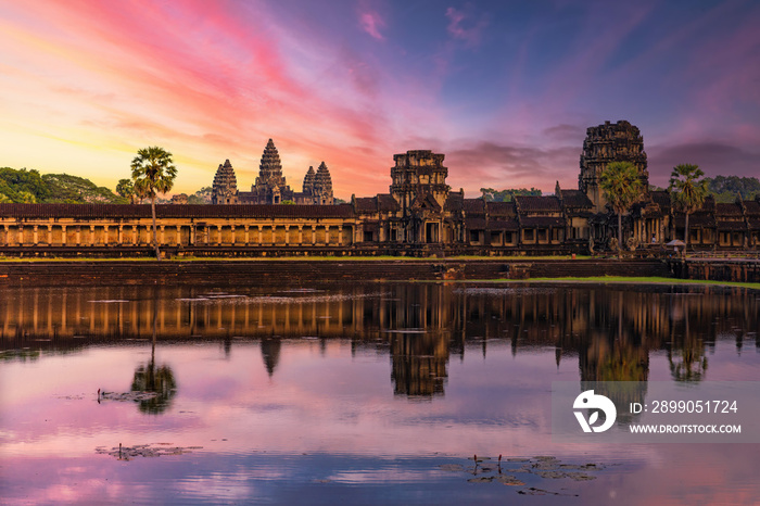 Angkor Wat temple reflecting in water of Lotus pond at sunset