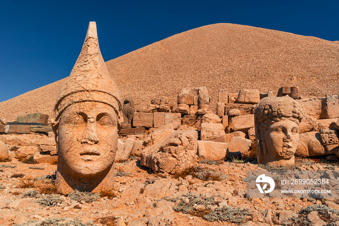 beautiful image of statues on nemrut mountain