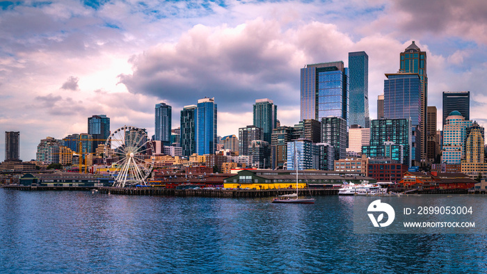 Seattle city skyline with dramatic clouds over Elliot Bay in Washington State, USA