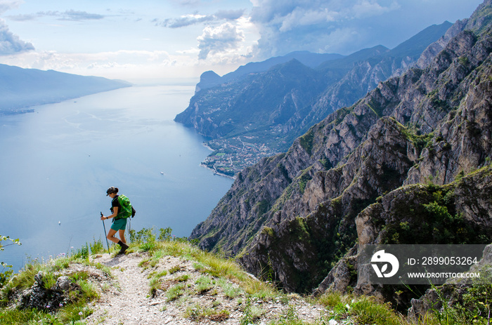 garda lake hiker with hiking sticks beautiful view