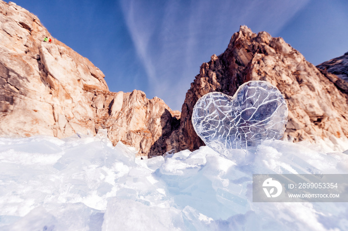 Arctic landscape with clear ice heart glacier frozen snow lake Baikal or Antarctica extreme with sun light