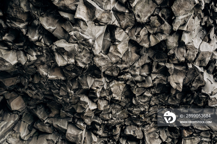 Closeup of texture of basalt stones on the beach of Vik, Iceland.