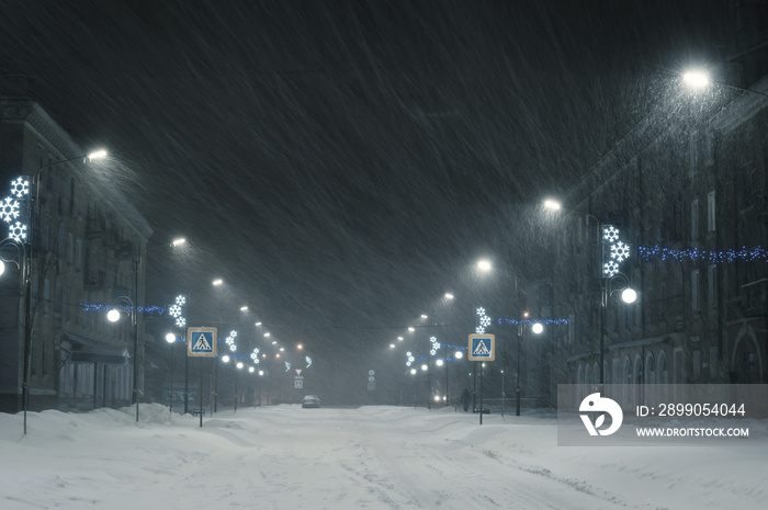 Winter landscape with snowstorm in city