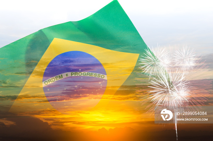 Brazil independence day, 7th september, double exposure waving Brazil flag and sunset sky with fireworks