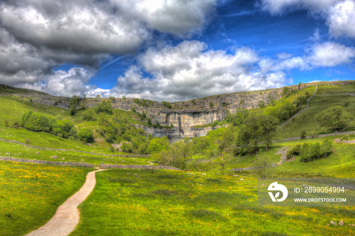 Malham Cove Yorkshire Dales National Park England UK popular tourist attraction in colourful hdr