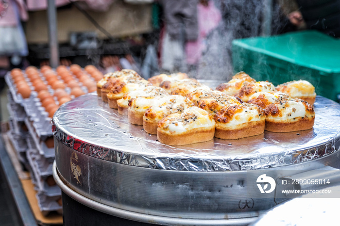 Egg bread with almond, peanut and sunflower seed at Myeong-dong street food, Seoul, South Korea