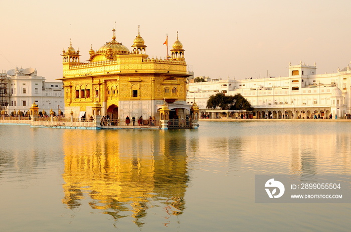 The golden temple of Sikh religion at sunset in Amritsar, Punjab, India.