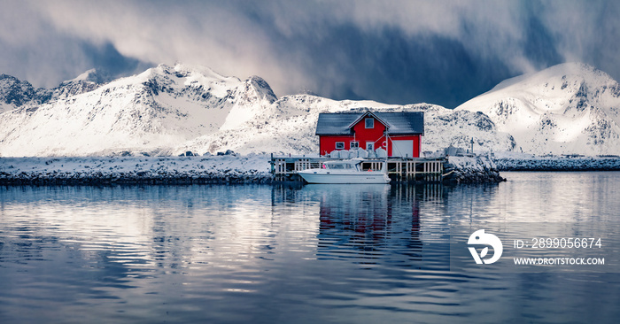 Panoramic winter view of small fishing village - Ramberg, Lofoten Islands, Norway, Europe. Dramatic morning seascape of Norwegian sea, Rambergsvika fjord. Cold outdoor scene over polar circle.