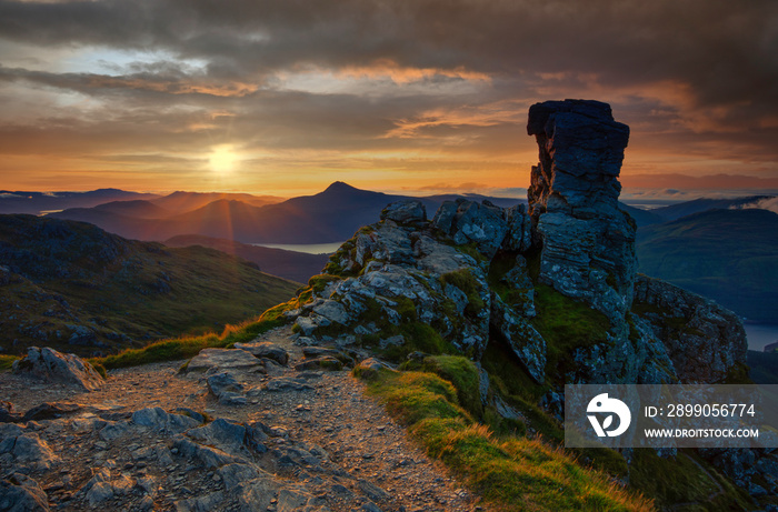 sunrise at the the distinctive rocky summit of Beinn Arthur, also known as The Cobbler, a popular mountain for climbing in the Arrochar Alps range of Argyll in the West Highlands of Scotland.