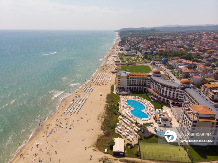 Aerial photo of the beautiful small town and seaside resort known as Obzor in Bulgaria showing the coastal hotels and people relaxing and having fun on the golden sunny beach of the Black Sea coast