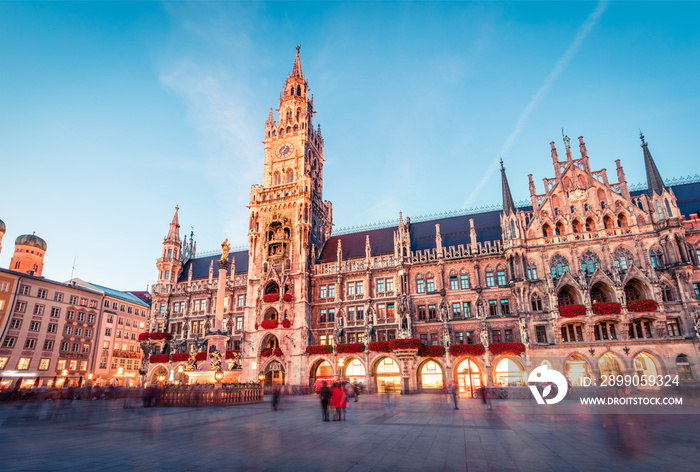 Fantastic evening view of Marienplatz - City-center square & transport hub with towering St. Peter’s church, two town halls and a toy museum, Munich, Bavaria, Germany, Europe.