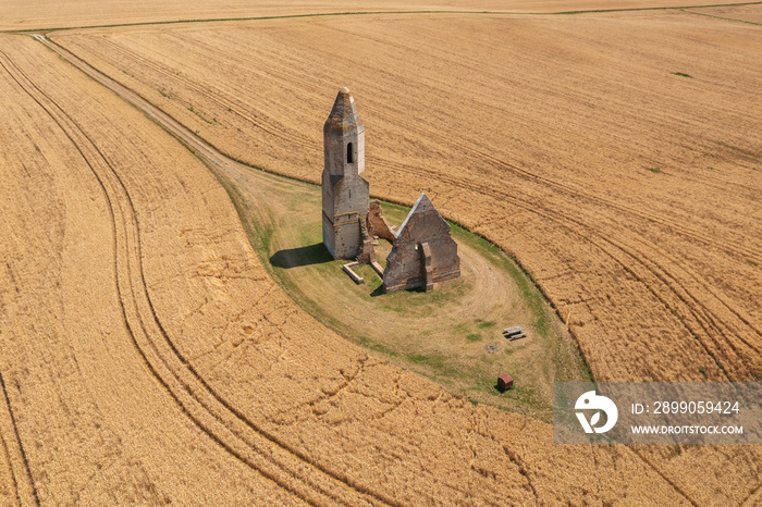 Somogyvámos, Hungary - Aerial view about abandoned church ruin named Pusztatemplom in the middle of an agricultural field.