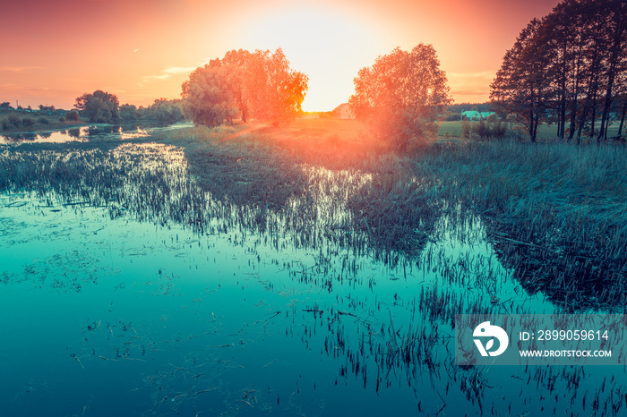 Early foggy morning. Sunrise over the lake. Rural landscape in the summer. Aerial view