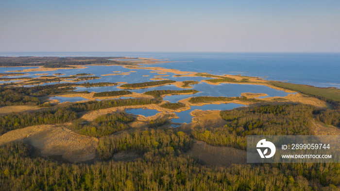 Aerial view to the amazing sunset colored coastal seascape with the complex lagoon archipelago pattern on Saaremaa island, Estonia