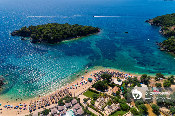 Aerial drone bird’s eye view of of Agia Paraskeui Beach with turquoise sea in complex islands in Parga area, Ionian sea, Epirus, Greece