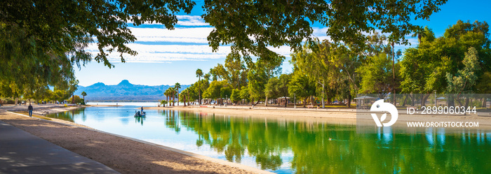 Tranquil lakefront walking trail landscape at Lake Havasu and turquoise-colored water in Havasu City, Arizona