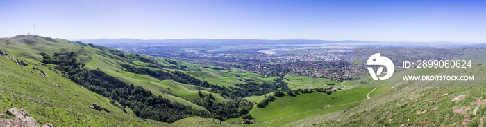 Panoramic view the green hills of south San Francisco bay from Mission peak; Monument Peak on the left; San Jose, Milpitas, Fremont and Newark in the background; California