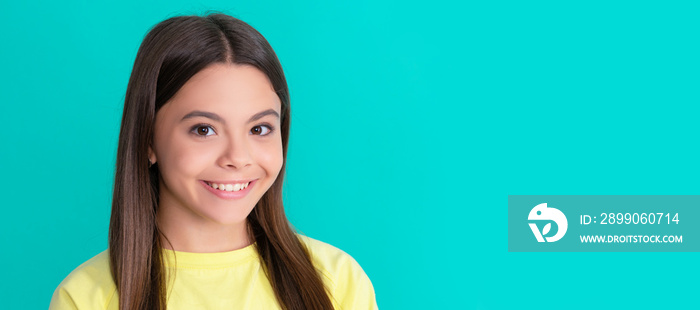 happy child with long hair on blue background. Child face, horizontal poster, teenager girl isolated portrait, banner with copy space.