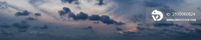 Dramatic cloudscape during a dark and colorful sunset.