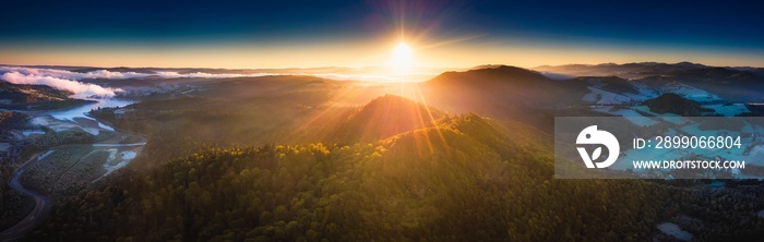 Sunrise over Bieszczady Mountains in Poland. Aerial panoramic landscape.