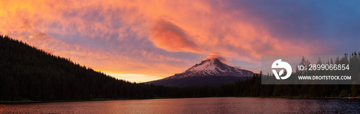 Beautiful Panoramic Landscape View of Mt Hood during a dramatic cloudy sunset. Taken from Trillium Lake, Mt. Hood National Forest, Oregon, United States of America.