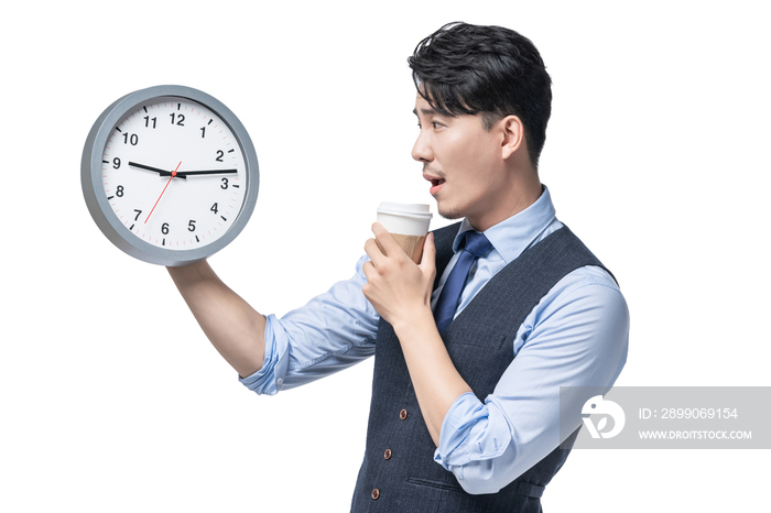 商务男士拿着时钟喝咖啡