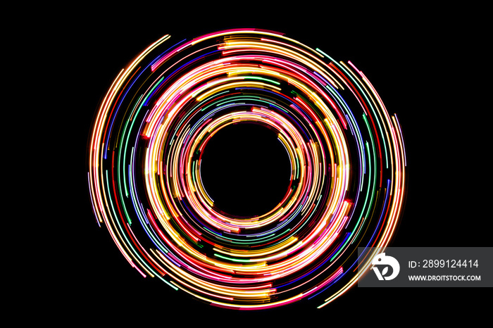 Abstract neon circle lines with empty copy space inside isolated on black background. Colorful led l