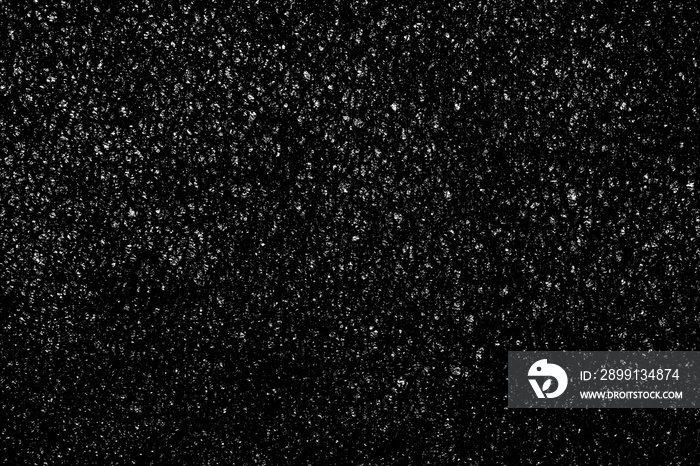 Falling snow on a black background. small particles with bright dots starry sky. Сhaotic white bokeh