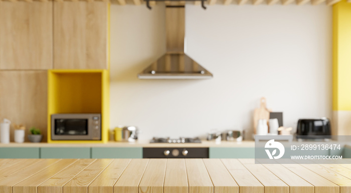 Empty wooden table and blurred kitchen yellow wall background/Wood table top on blur kitchen counter