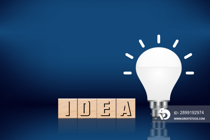 Glowing idea light bulb and innovation thinking creative concept on success inspiration blue backgro