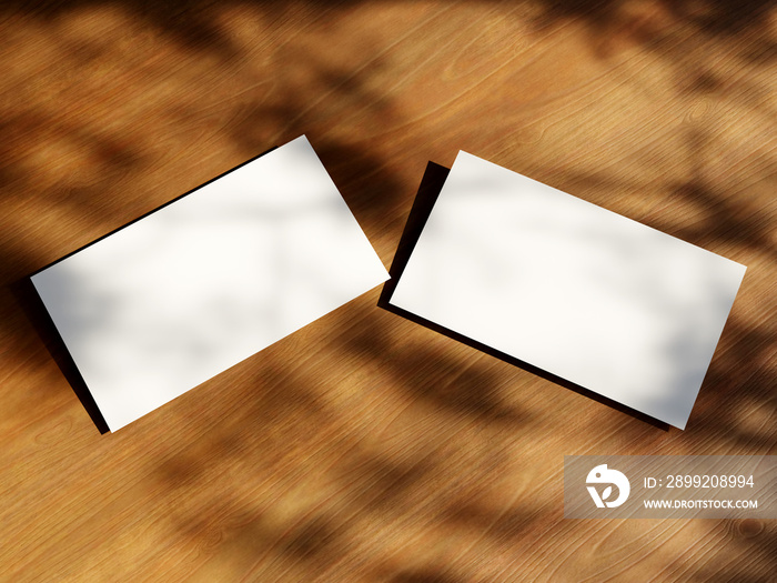 Clean minimal business card mockup with the leaves shadow on wood table background