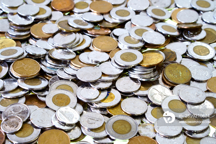 Spare change of canadian metal money spread and filling the frame. Dime, quarter, one, two dollar money.